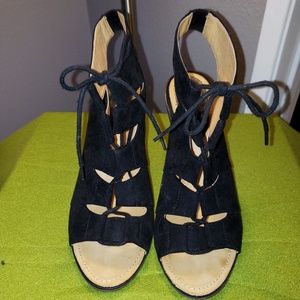 Black suede gladiator open back wedges.